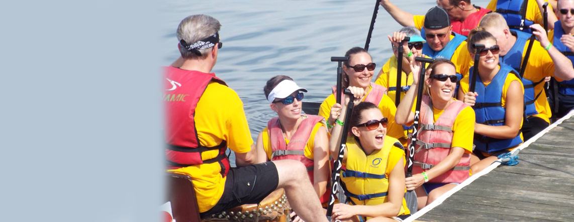 WLU Toppers sitting in dragonboat, ready to race