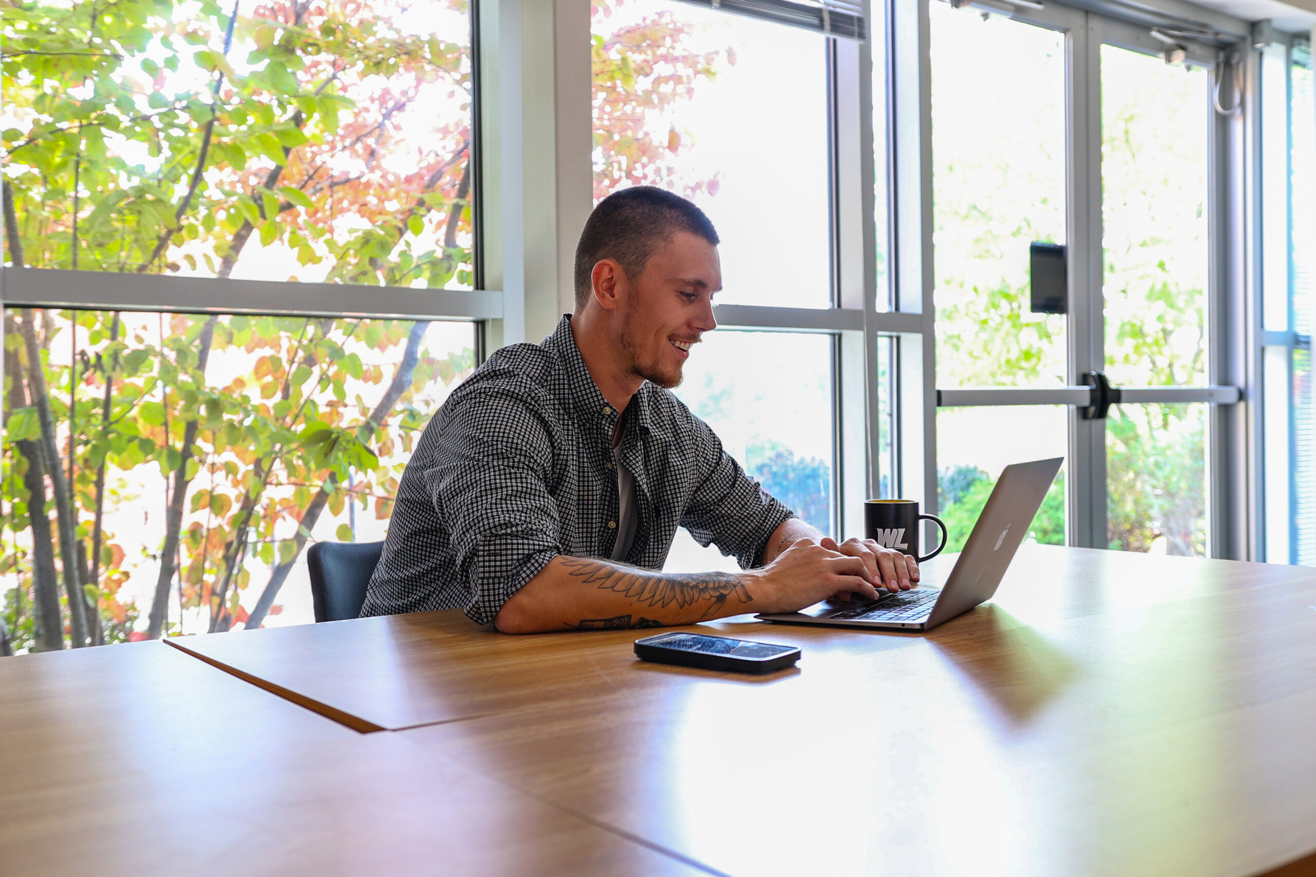 Male student working on laptop