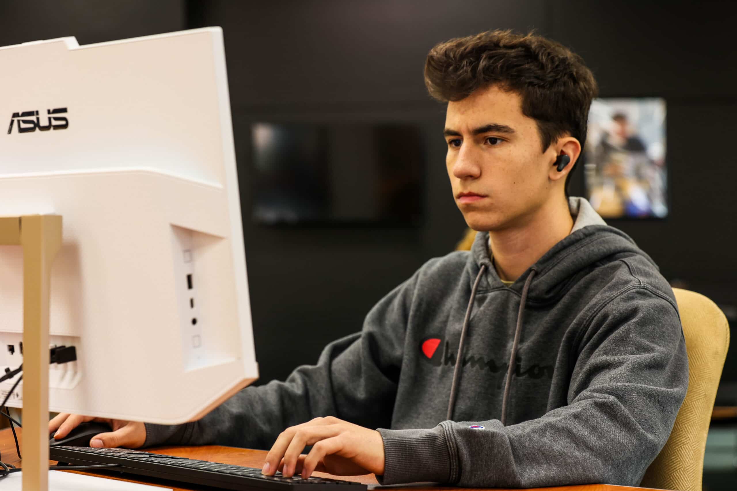 Student working at a desktop.