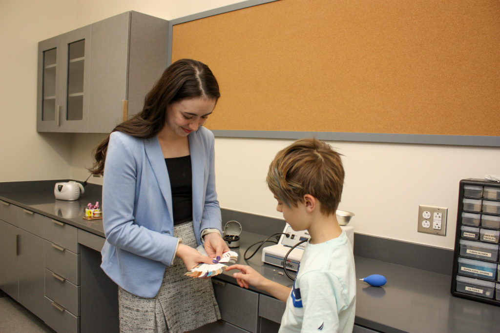 Speech-Language Pathology Master's Degree graduate of West Liberty University helping a patient