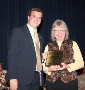 Student Government Vice President Jeffrey Tice presents the Professor of the Year Award to Sandy Czernek.