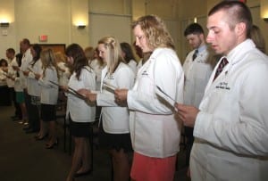 The 2016 Class of Physician Assistants recite the professional oath.