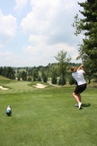 Action shot with girl golfer