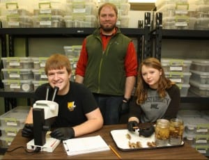 Dr. Loughman is shown with students Zachary Dilliard and Katie Scott.
