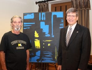 Ben Ray and his donated painting are shown with President Stephen Greiner. 