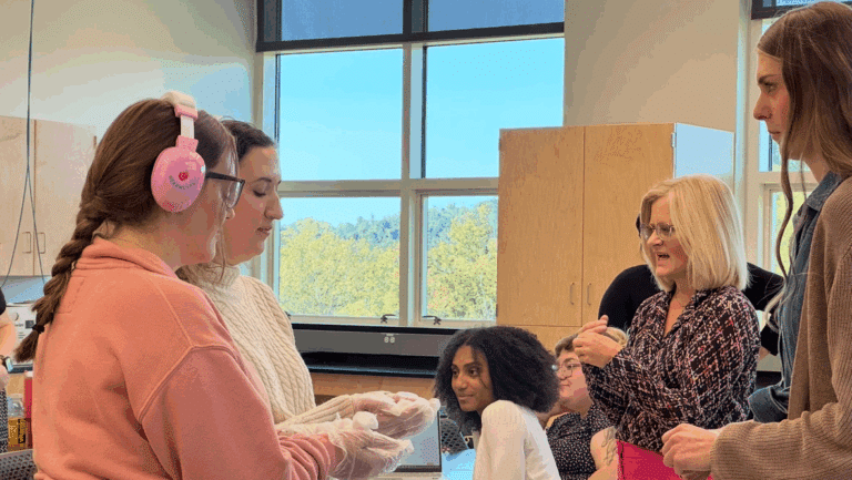 First-year MS SLP graduate students (left), Kendall Kropp and Maria Goudy are guided by second-year MS SLP graduate student (right), Kara Kapiskosky, and Dr. Carol Zombotti in preparing simulation experiences.