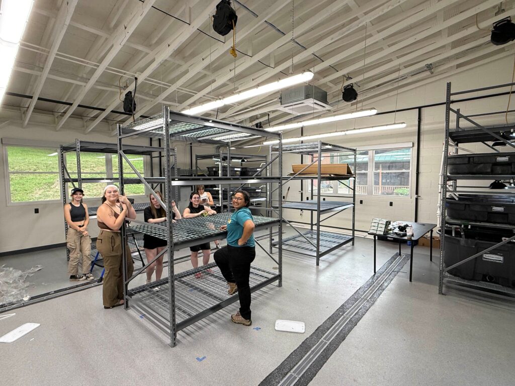 Associate Curator Tanya Khan has overseen the construction of both the turtle and crayfish propagation labs at the AACC. Here she is with several students who spent the summer assisting with the AACC's husbandry spaces construction.
