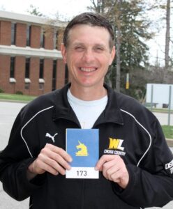 Coach Eric Laughlin displayed his bib number 173 before he left for Boston, last Tuesday.
