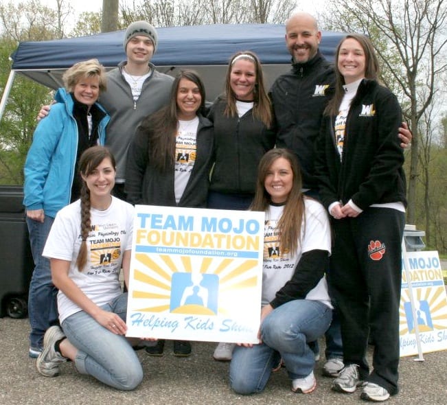 From left, Laura Denning, Jordan Crawford, Shayla Sopko, Kayla Pace, Rick West, Jordan Ramsey, Kristi Hardesty and Desiree Dennis get together to promote the 5K.