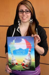 Alexis Irvin is shown with her West Virginia Italian Heritage Festival design.