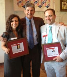 Sen. Joe Manchin is shown congratulating Angela Zambito-Hill and Jason Koegler at the Culture Center.