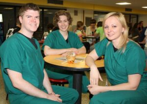 PAs Kent Phillips, Griffin, Ga., Sarah Brammer, Wheeling and Natalia Doroshenko, Falling Waters, W.Va., enjoy a quick lunch in the College Union.