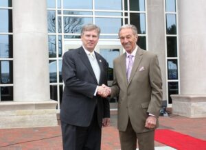 From left President Capehart shakes hands with Dr. Clyde D. Campbell, president emeritus and namesake of the new Hall of Health Sciences.