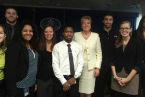 Abbey is the fourth student from the left in this photo, snapped at a special luncheon at the U.S. Marshal Service internship. She is standing next to her coworker Ariel XXX and center is