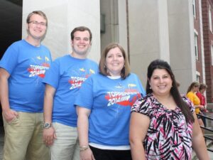 Student Government leaders Evan Newman and Jeffrey Tice join Administrators Marcella Snyder and Bridgett Dawson on the steps of Main Hall as they discuss the positive role of new safety programs.