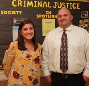 Hannah Walters and Dr. Keith Bell are shown in Main Hall.