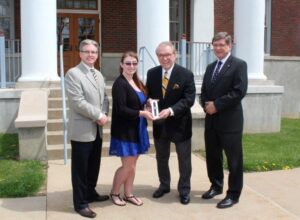 Alumni Director Ron Witt, Jessica Ballard, John Bonassi and President Stephen Greiner outside Shaw Hall during ...