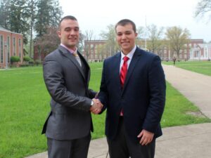 President Reid Boden (red tie) and Vice President David Cullinan look forward to the future.