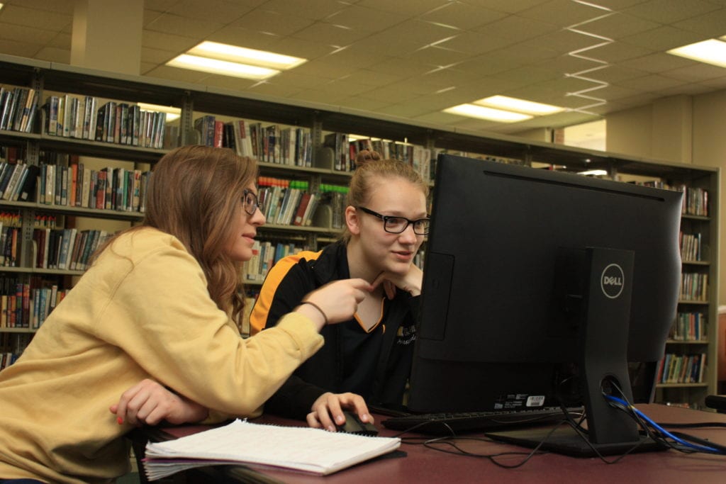 IMG 7945 female students computer library scaled 2