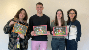 Students holding certificates. From left to right, Eliza Aguirre, James Salvatori, Morgan Howard, Prof. Kang