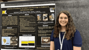 Mackenzi Daub exhibiting her poster presentation