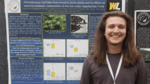 Noah Meyers at his poster (Jr. - BS EEOB)
