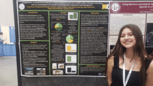 Reagan Bally in front of her poster (freshman EEOB)